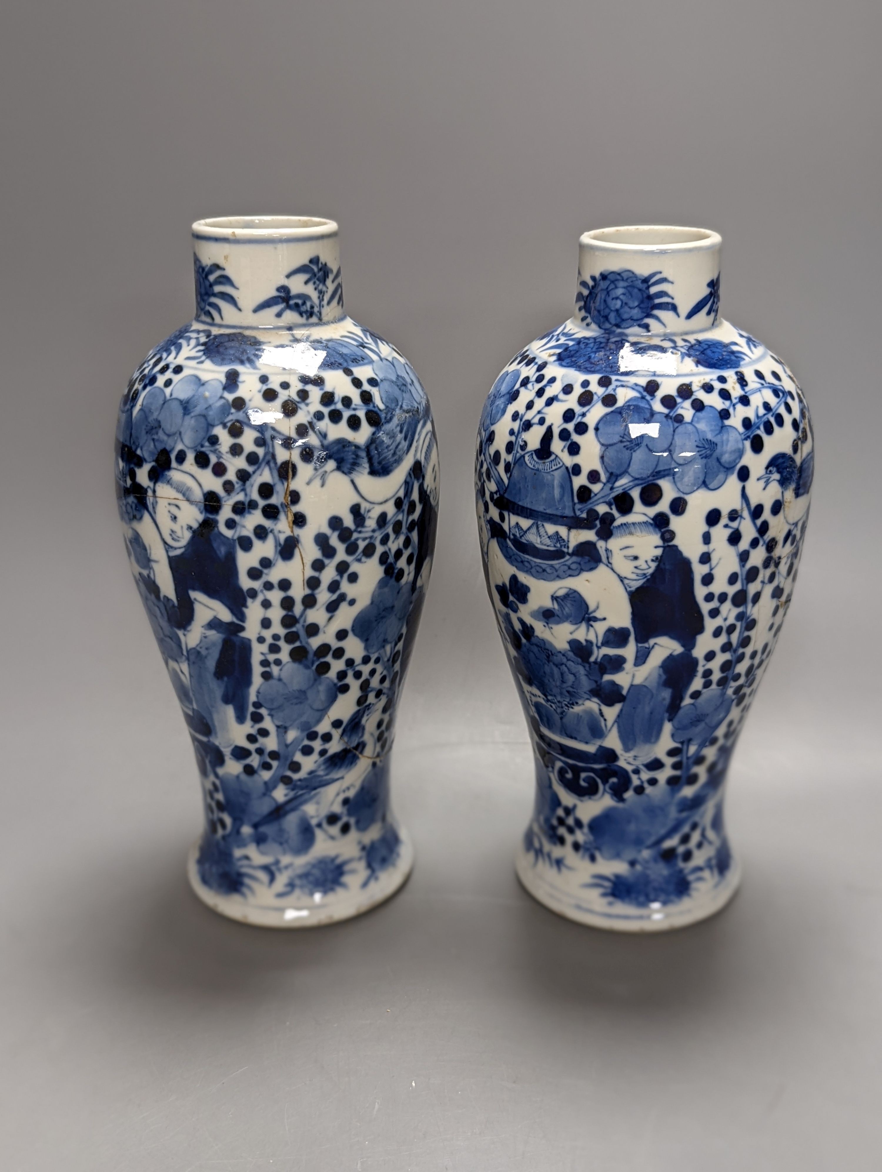 A pair of 19th century Chinese blue and white vases, a prunus vase and cover and a similar jar (4), pair of vases 24 cms high.